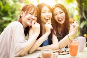 Group of young woman laughing in restaurant